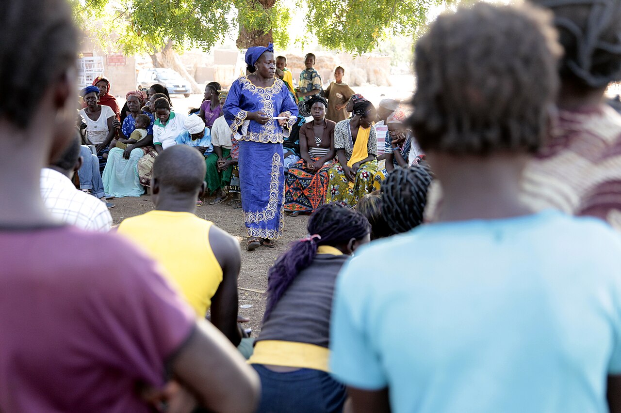 A woman addressing a community gathering